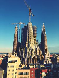 Low angle view of buildings against blue sky