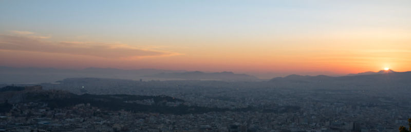 Scenic view of sunset over city