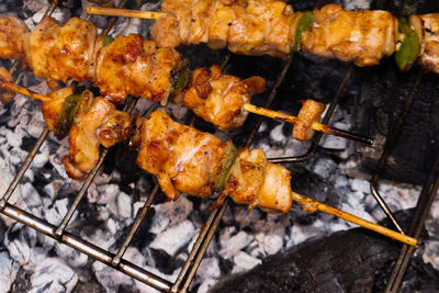 Close-up of meat on barbecue grill
