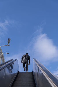 Low angle view of man against sky