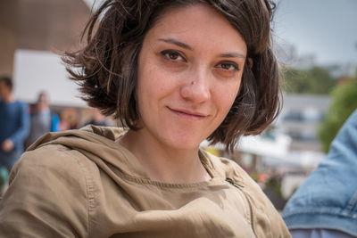 Close-up portrait of a smiling young woman