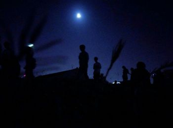 Silhouette of people at night