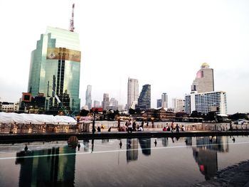 Modern buildings in city against clear sky