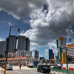 City street and buildings against sky