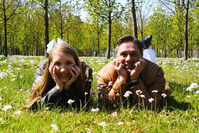 Portrait of smiling girl sitting on grass