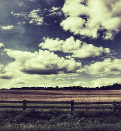 Scenic view of landscape against cloudy sky