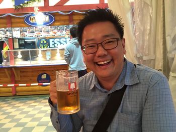 Portrait of woman holding beer glass