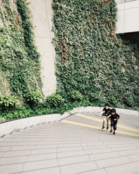 Woman walking on footpath