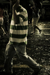 People running on street in city