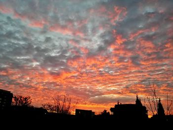 Low angle view of dramatic sky during sunset