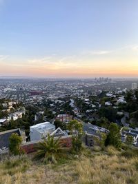 High angle view of townscape against sky during sunset