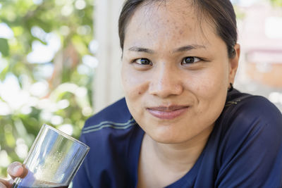 Close-up of young woman drinking glass