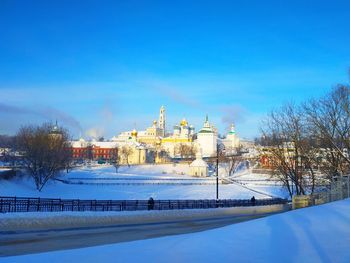 Buildings against blue sky during winter
