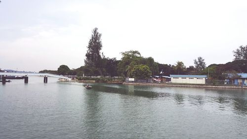 Swimming pool in city against sky