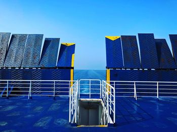 Low angle view of ship against clear blue sky