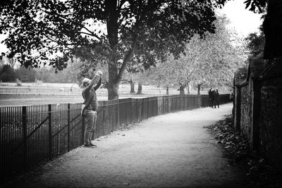 Woman standing amidst trees