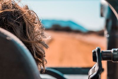 Close-up portrait of woman in car