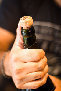 Close-up of hand holding wineglass