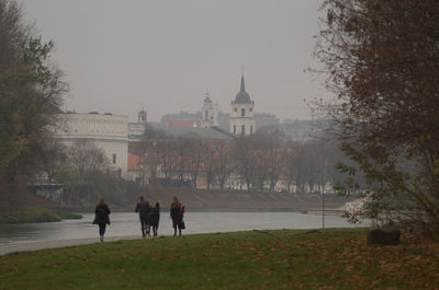 Group of people walking in front of building