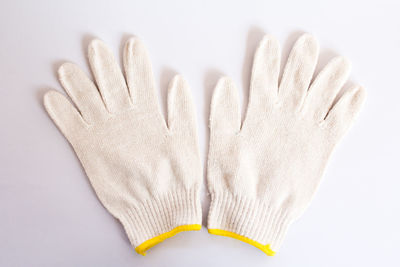 Close-up of hand over white background