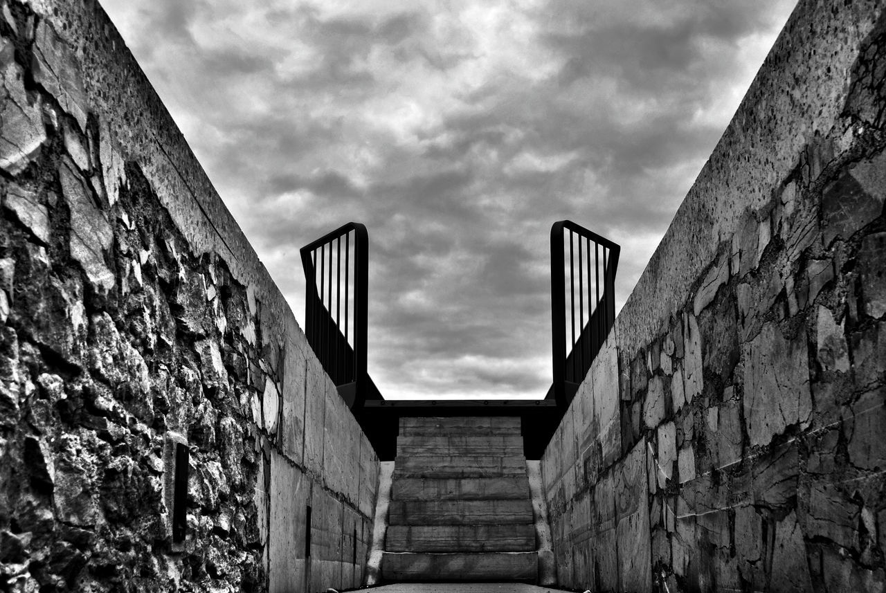 architecture, built structure, building exterior, low angle view, sky, cloud - sky, brick wall, wall - building feature, cloudy, building, stone wall, cloud, old, day, outdoors, steps, wall, no people, history, overcast