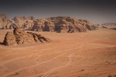 Scenic view of desert landscape against sky