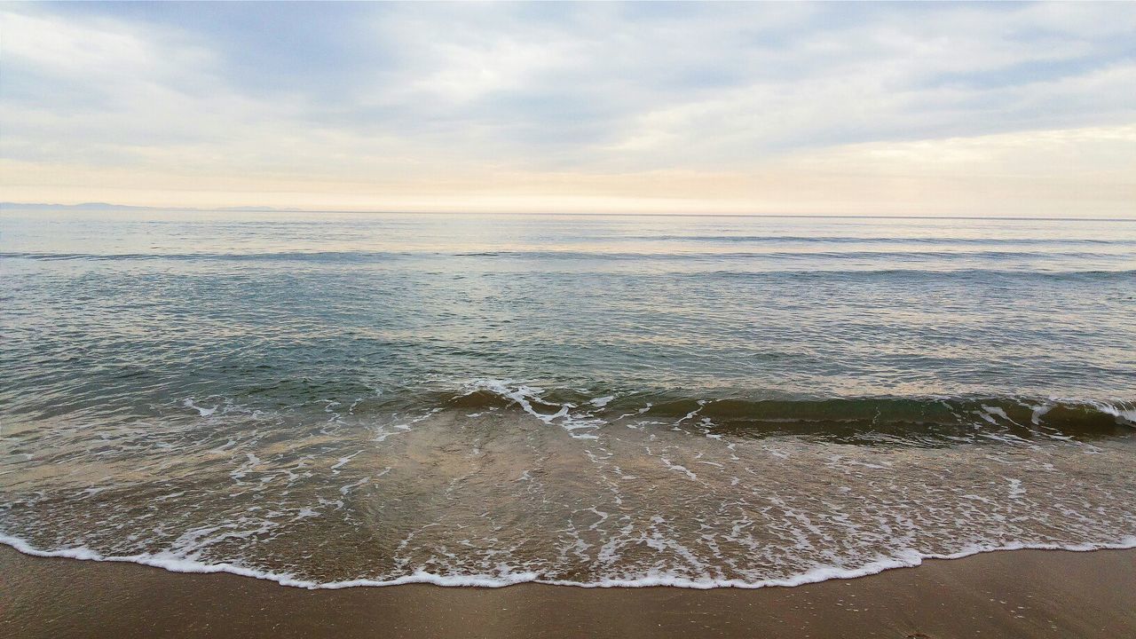 sea, water, horizon over water, beach, sky, wave, scenics, shore, beauty in nature, surf, tranquil scene, tranquility, cloud - sky, sand, nature, idyllic, cloudy, cloud, seascape, coastline