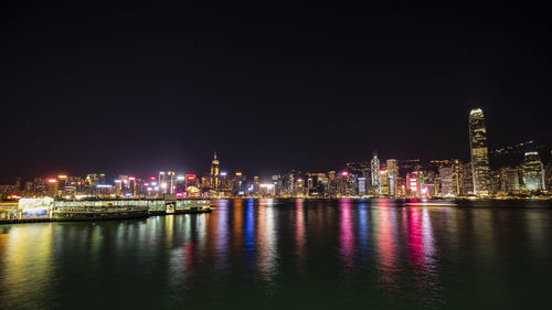 Illuminated buildings in city at night