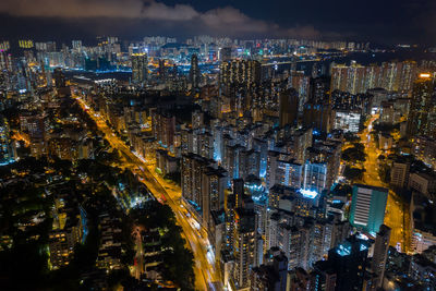 High angle view of city lit up at night