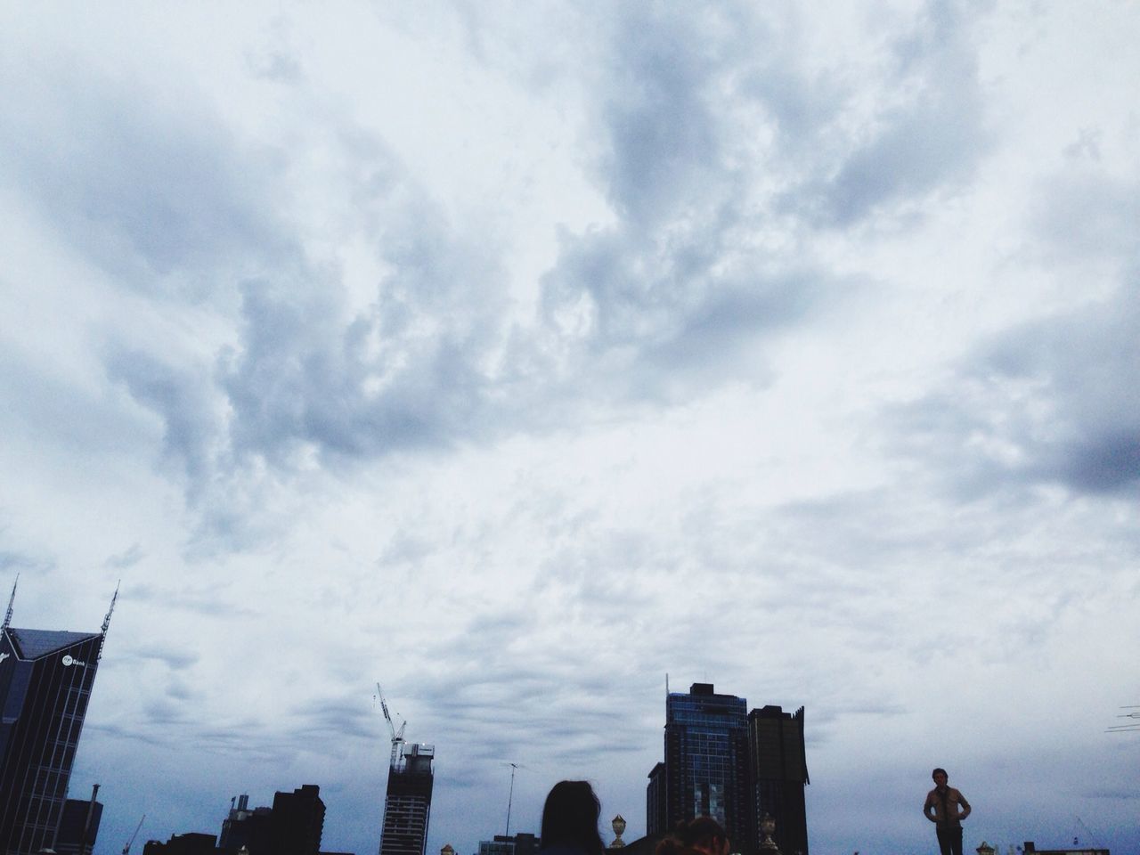 building exterior, architecture, built structure, sky, low angle view, city, cloud - sky, skyscraper, cloudy, tall - high, silhouette, building, office building, cloud, modern, tower, urban skyline, outdoors, city life, day