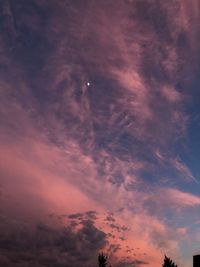 Low angle view of dramatic sky during sunset