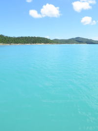 Scenic view of sea against blue sky