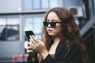 Young woman using mobile phone