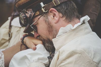 Close-up of man kissing hand