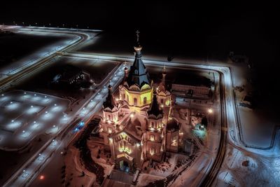 High angle view of illuminated buildings in city at night