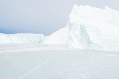 Ice bergs on frozen sea, greenland.