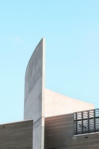 Low angle view of built structure against clear blue sky