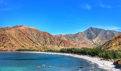 Scenic view of mountains against clear blue sky