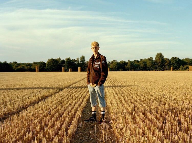 WOMAN STANDING IN A FIELD