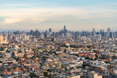 High angle view of modern buildings in city against sky