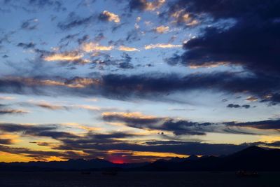 Scenic view of dramatic sky over sea during sunset