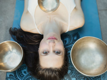 High angle view of young woman sitting on table