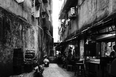 Narrow alley amidst buildings in city