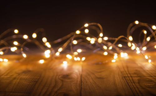 Close-up of illuminated lights on table