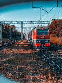Train on railroad track against sky