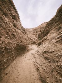 Scenic view of arid landscape against sky