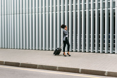 Full length of a woman walking in city