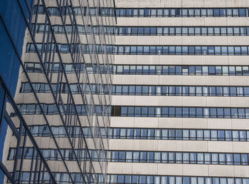 Low angle view of modern glass building in city