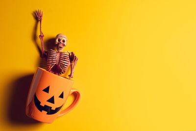 Smiling boy against yellow background