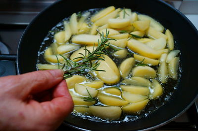 Close-up of hand preparing food